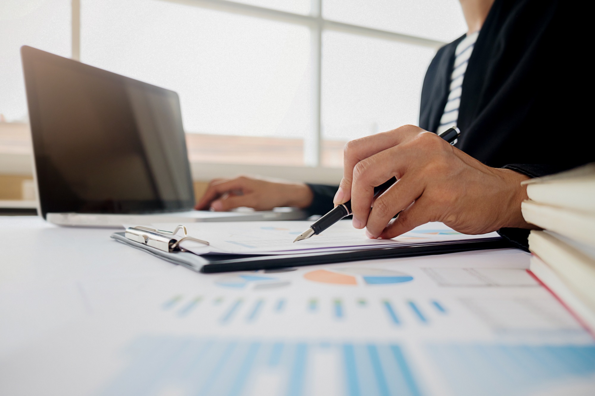 Business adviser analyzing financial figures denoting the progress Internal Revenue Service checking